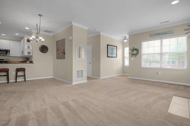 262 Alexander Lawrence Dr, Pickerington, OH 43147 - unfurnished living room featuring crown molding, light colored carpet, a chandelier, and recessed lighting