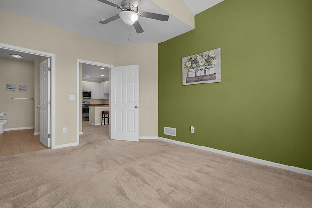262 Alexander Lawrence Dr, Pickerington, OH 43147 - unfurnished bedroom with light carpet, connected bathroom, and a ceiling fan
