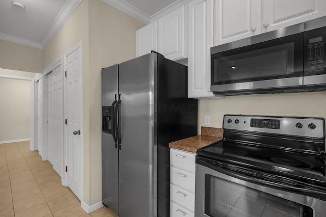 262 Alexander Lawrence Dr, Pickerington, OH 43147 - kitchen with appliances with stainless steel finishes, ornamental molding, white cabinetry, dark countertops, and light tile patterned flooring