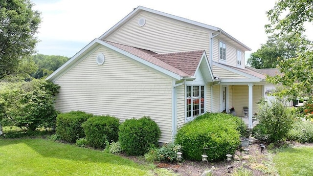 2 Delaware Dr, Fredericktown, OH 43019 - view of property exterior with a lawn and roof with shingles