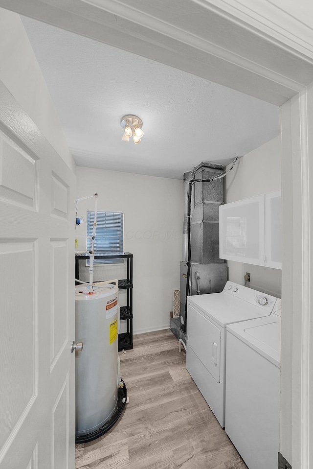 25 Victorian Gate Way, Columbus, OH 43215 - laundry area with separate washer and dryer, water heater, light wood-type flooring, and cabinet space