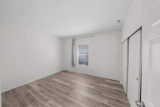 25 Victorian Gate Way, Columbus, OH 43215 - unfurnished bedroom with wood finished floors and a closet