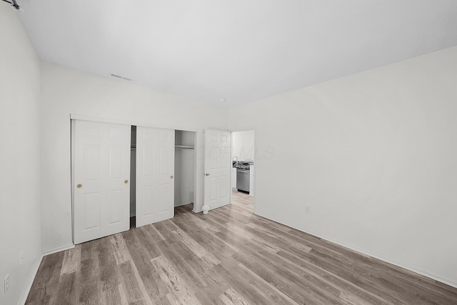 25 Victorian Gate Way, Columbus, OH 43215 - unfurnished bedroom with light wood-style flooring and a closet