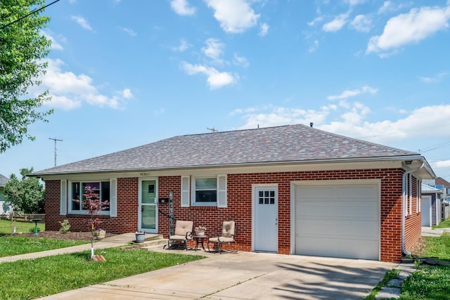 320 W Liberty St, Bucyrus, OH 44820 - view of front of home with brick siding, a garage, driveway, and a shingled roof
