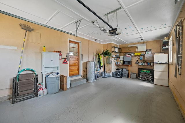 320 W Liberty St, Bucyrus, OH 44820 - garage with a garage door opener and electric panel