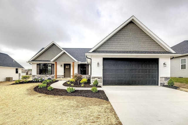 551 Cannondale Ave, Johnstown, OH 43031 - craftsman house with stone siding, an attached garage, and concrete driveway