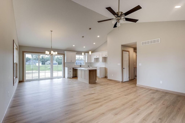 551 Cannondale Ave, Johnstown, OH 43031 - kitchen featuring high vaulted ceiling, open floor plan, a center island, white cabinetry, and recessed lighting