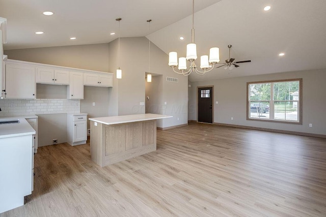 551 Cannondale Ave, Johnstown, OH 43031 - kitchen featuring a center island, light wood-style flooring, a chandelier, high vaulted ceiling, and white cabinets