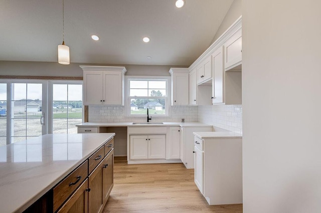 551 Cannondale Ave, Johnstown, OH 43031 - kitchen with light wood-type flooring, tasteful backsplash, decorative light fixtures, recessed lighting, and white cabinets