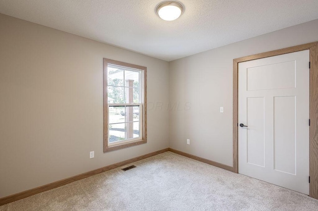 551 Cannondale Ave, Johnstown, OH 43031 - spare room featuring carpet floors and a textured ceiling