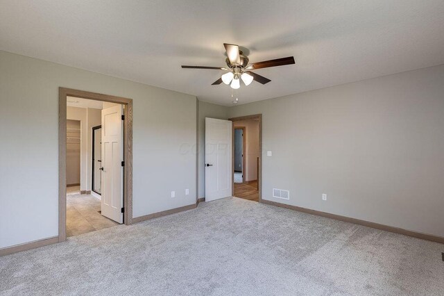 551 Cannondale Ave, Johnstown, OH 43031 - unfurnished bedroom featuring light carpet and a ceiling fan