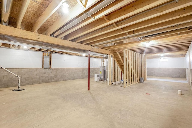 551 Cannondale Ave, Johnstown, OH 43031 - unfinished basement featuring electric panel, electric water heater, drainage system, and stairs