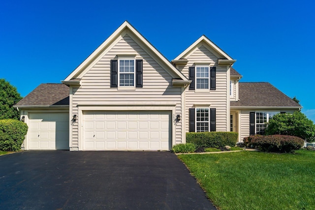 4694 Tayport Ave, Grove City, OH 43123 - traditional-style house with asphalt driveway, a front yard, a shingled roof, and an attached garage
