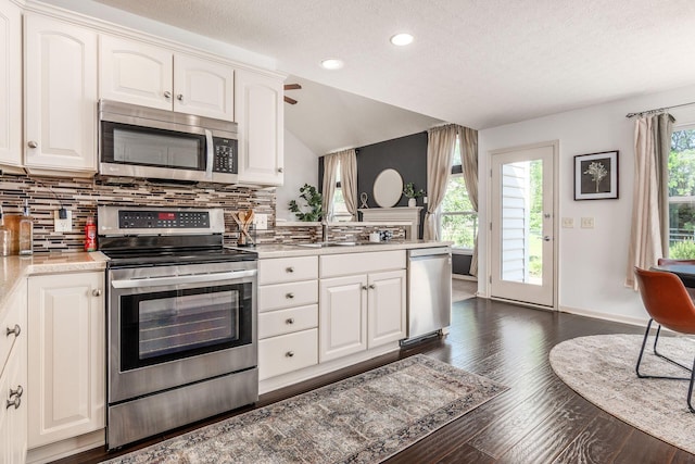 4694 Tayport Ave, Grove City, OH 43123 - kitchen featuring stainless steel appliances, a textured ceiling, decorative backsplash, light countertops, and dark wood-style floors