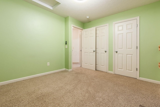 4694 Tayport Ave, Grove City, OH 43123 - unfurnished bedroom with light colored carpet, attic access, a textured ceiling, and a closet