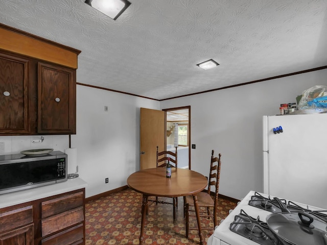 1018 Harrison Ave, Lancaster, OH 43130 - dining space with a textured ceiling and ornamental molding