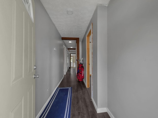 1018 Harrison Ave, Lancaster, OH 43130 - hall featuring a textured ceiling and dark wood-type flooring