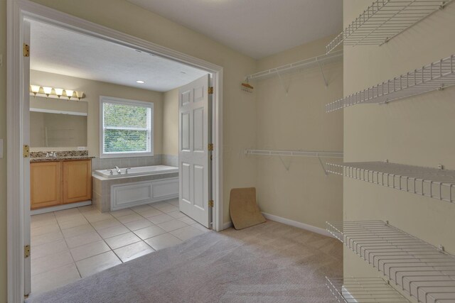 7511 Windsor Dr, Dublin, OH 43016 - spacious closet with light tile patterned floors and light colored carpet