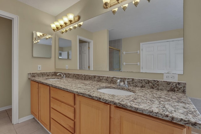 7511 Windsor Dr, Dublin, OH 43016 - full bath featuring double vanity, tiled shower, and tile patterned flooring