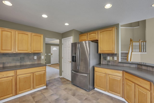 7511 Windsor Dr, Dublin, OH 43016 - kitchen with stainless steel fridge with ice dispenser, dark countertops, backsplash, recessed lighting, and light brown cabinets
