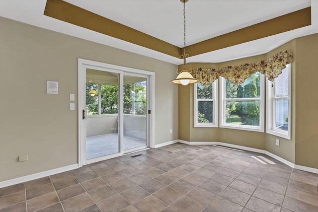 7511 Windsor Dr, Dublin, OH 43016 - unfurnished room featuring dark tile patterned floors and a tray ceiling