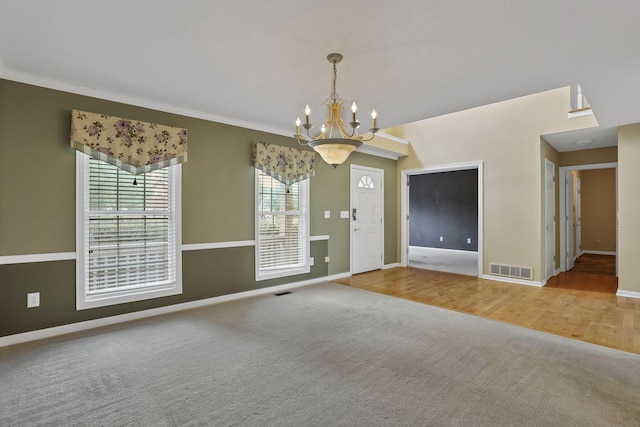 7511 Windsor Dr, Dublin, OH 43016 - carpeted spare room with a chandelier and crown molding