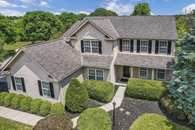 7511 Windsor Dr, Dublin, OH 43016 - view of front of property featuring a porch and a shingled roof