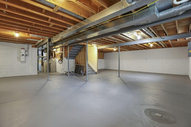 7511 Windsor Dr, Dublin, OH 43016 - unfinished below grade area featuring a central vacuum unit and stairs