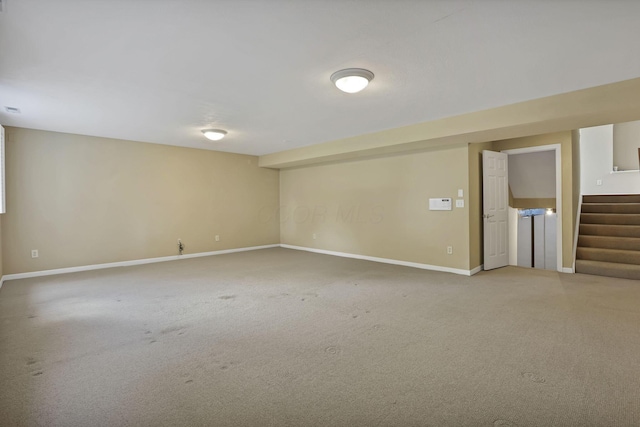 7511 Windsor Dr, Dublin, OH 43016 - finished below grade area featuring stairway and light colored carpet