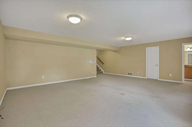 7511 Windsor Dr, Dublin, OH 43016 - finished below grade area featuring stairs and light colored carpet
