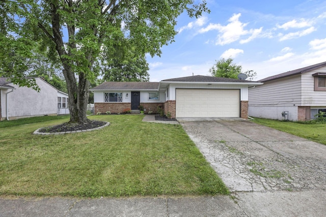 3171 Haskell Dr, Columbus, OH 43219 - ranch-style house featuring brick siding, driveway, an attached garage, and a front yard