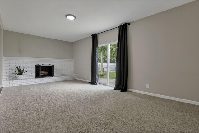 3171 Haskell Dr, Columbus, OH 43219 - unfurnished living room with carpet flooring and a brick fireplace