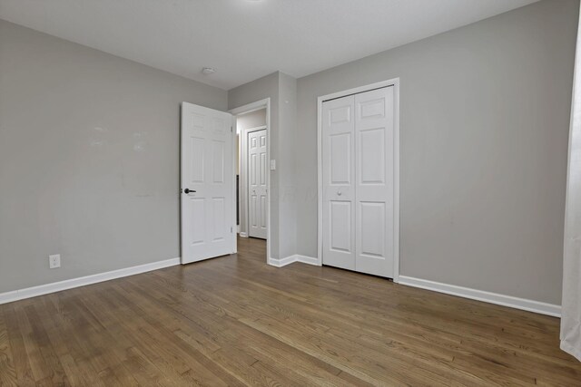 3171 Haskell Dr, Columbus, OH 43219 - unfurnished bedroom with wood finished floors and a closet