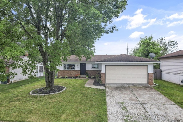 3171 Haskell Dr, Columbus, OH 43219 - ranch-style home featuring brick siding, driveway, an attached garage, and a front yard