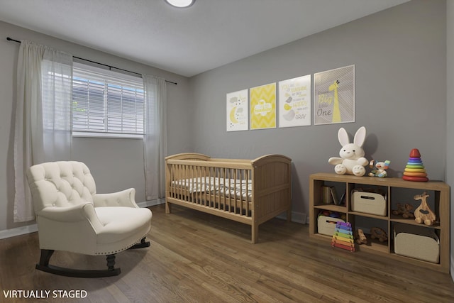 3171 Haskell Dr, Columbus, OH 43219 - bedroom featuring a crib and wood finished floors