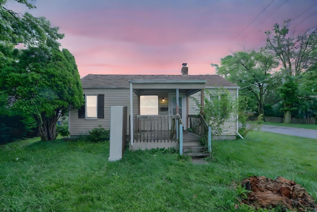 3166 Howey Rd, Columbus, OH 43224 - bungalow with a chimney, a porch, and a lawn