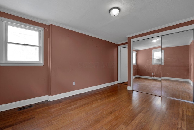 3166 Howey Rd, Columbus, OH 43224 - unfurnished bedroom with hardwood / wood-style floors and crown molding