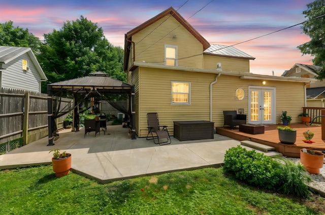115 Maple Ave, Utica, OH 43080 - rear view of property with french doors, a gazebo, an outdoor hangout area, a fenced backyard, and a deck