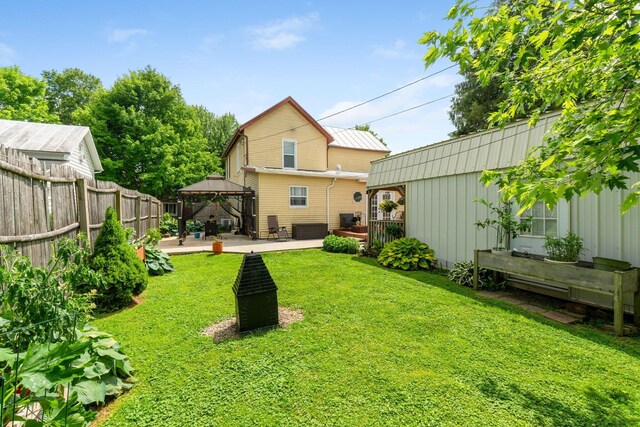 115 Maple Ave, Utica, OH 43080 - back of property featuring a gazebo, a patio area, board and batten siding, and a deck