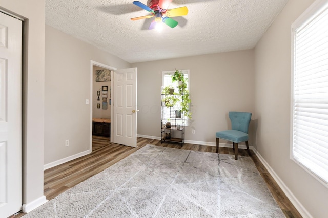 115 Maple Ave, Utica, OH 43080 - sitting room with wood finished floors, a textured ceiling, and a ceiling fan