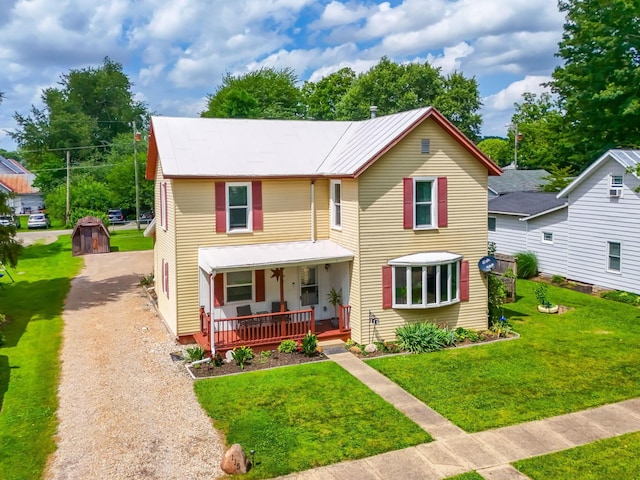 115 Maple Ave, Utica, OH 43080 - view of front of property with covered porch, a front yard, and gravel driveway