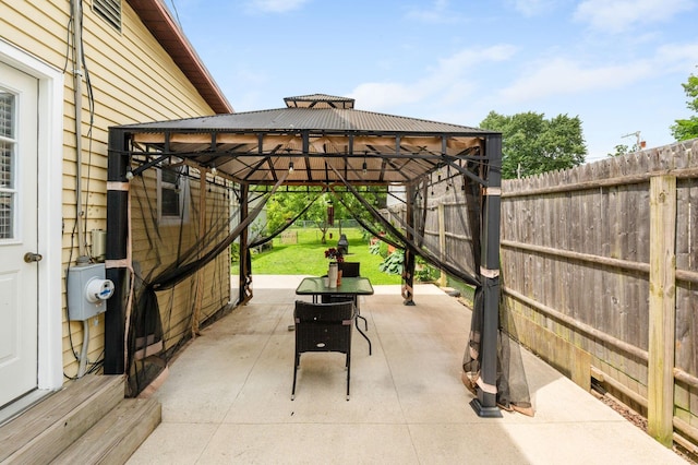 115 Maple Ave, Utica, OH 43080 - fenced backyard featuring a gazebo and a patio