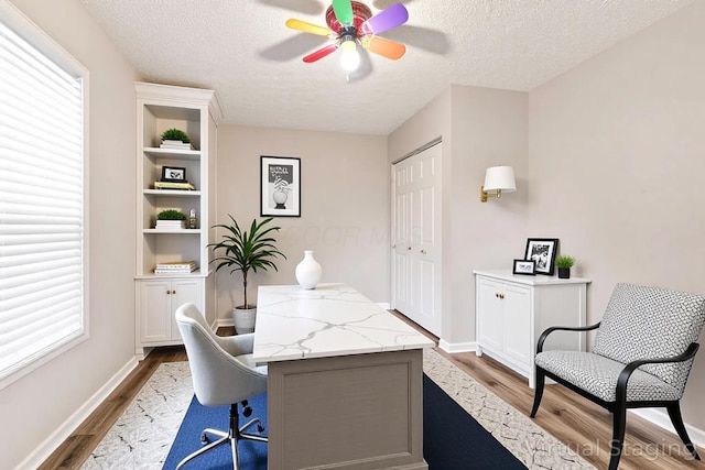 115 Maple Ave, Utica, OH 43080 - home office featuring dark wood-type flooring, a ceiling fan, and a textured ceiling