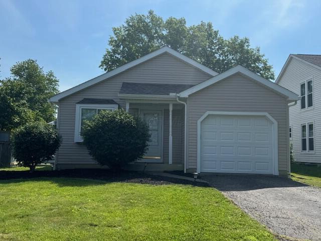 7838 Kiowa Way, Columbus, OH 43085 - ranch-style home featuring a garage, driveway, and a front lawn