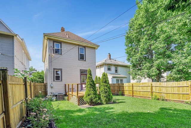 520 E Jenkins Ave, Columbus, OH 43207 - rear view of property featuring a fenced backyard, a deck, and a chimney