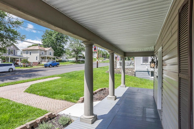 522 S Main St, New Lexington, OH 43764 - porch featuring a yard and a residential view