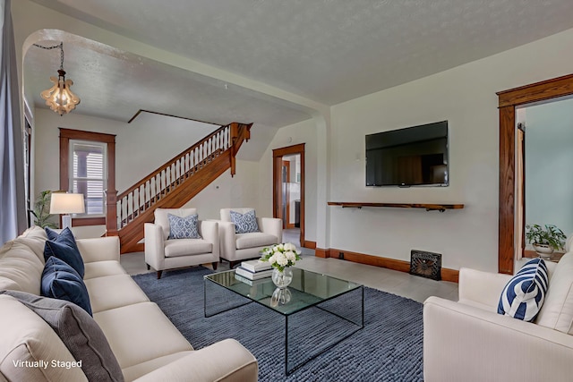 522 S Main St, New Lexington, OH 43764 - living room with stairway and a textured ceiling
