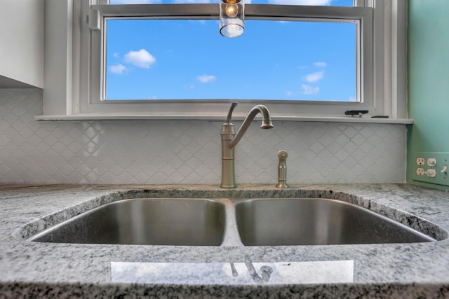 522 S Main St, New Lexington, OH 43764 - kitchen view of white cabinetry, tasteful backsplash, and light stone countertops