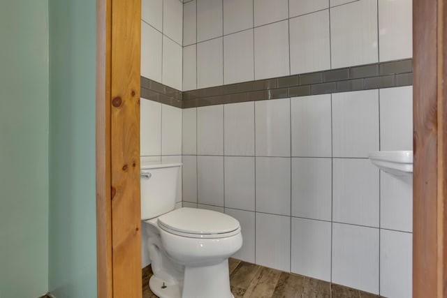 522 S Main St, New Lexington, OH 43764 - bathroom featuring tile walls and wood finished floors