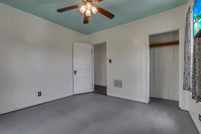 522 S Main St, New Lexington, OH 43764 - unfurnished bedroom with wood finished floors, ceiling fan, and a closet